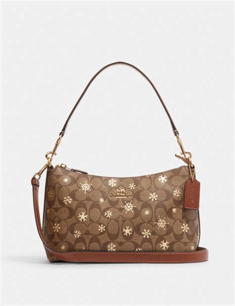 coach purse with snowflakes.